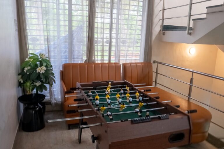 Vandana Villa, Alibag: Foosball beside a leather sofa by the window