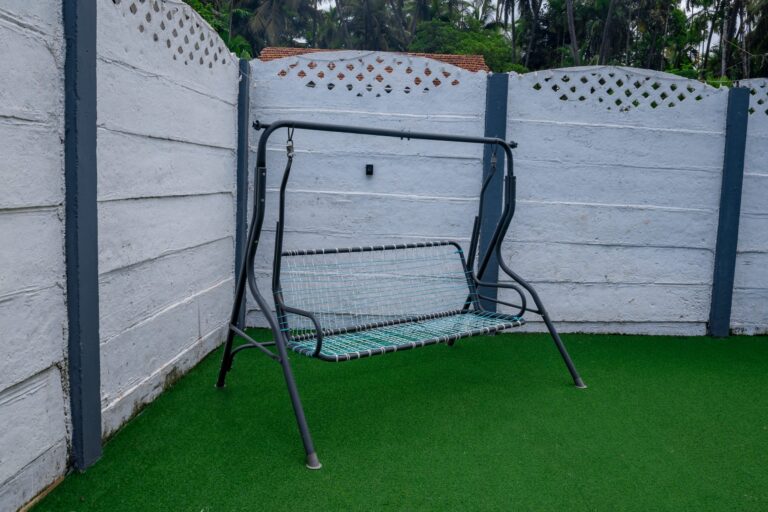 Vandana Villa, Alibag: Swing seat on the turf lawn