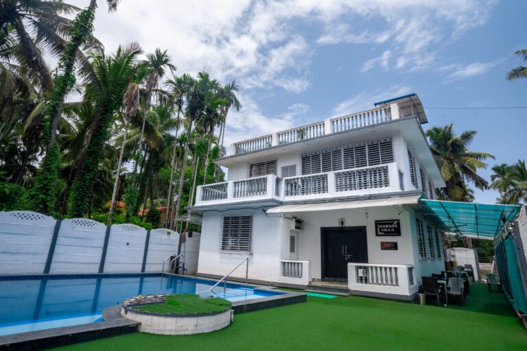 Vandana Villa, Alibag: The villa and the round turf planter at the pool steps