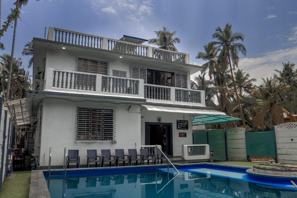 Vandana Villa, Alibag: chairs along the verandah, facing the private pool